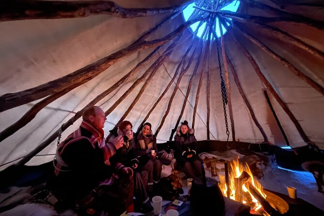 Arctic Fjords and Reindeer Experience – Small group tour - Inside the lavvo with fire, hot drinks, and joik