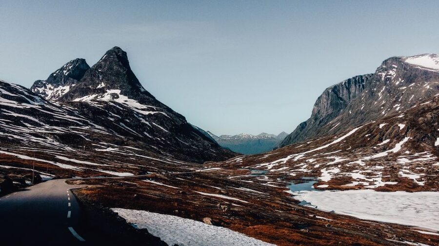 From Ålesund: Trollstigen Sightseeing Village & Fjord Tour - Sjøholt and Valldal: villages with a local connection