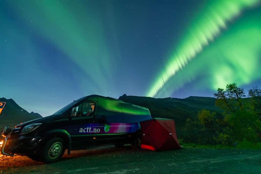 From Tromsø: Aurora Minibus Chase with Portrait and Hot Meal - Warm suits, boots, and ice spikes