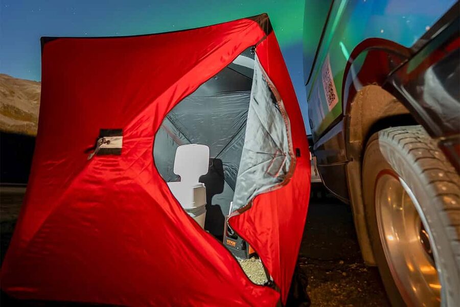 From Tromsø: Aurora Minibus Chase with Portrait and Hot Meal - Camp beside a lake, bay, or beach