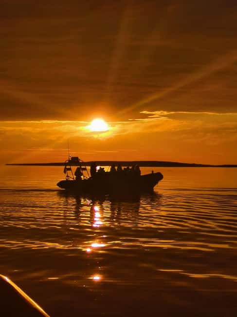 Midnight sun safari - Leaving Henningsvær through the narrow straits