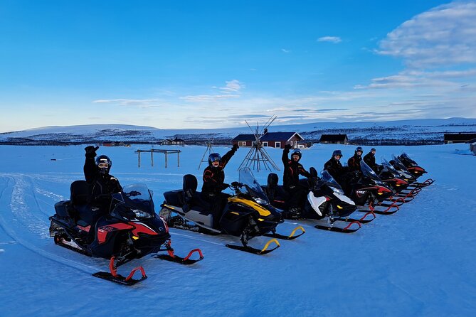 Snowmobile safari in the mountain plateau of Finnmarksvidda - Getting suited up before the engines start
