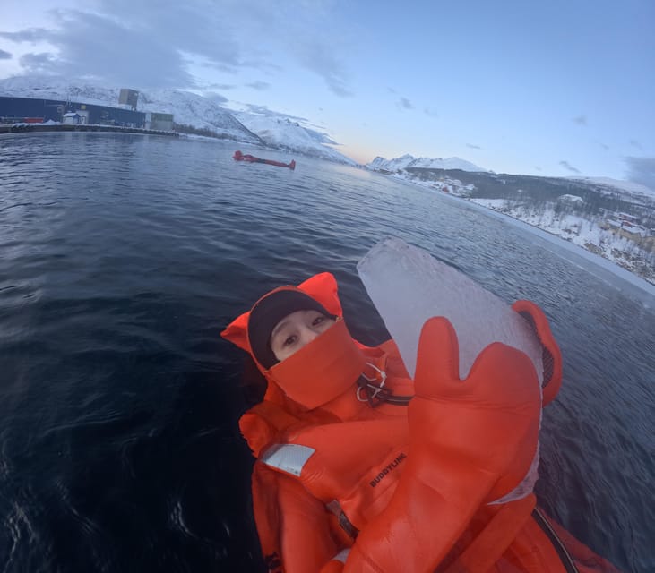 Tromsø: Arctic Fjord Floating in Survival Suit - Getting comfortable in an orange survival suit