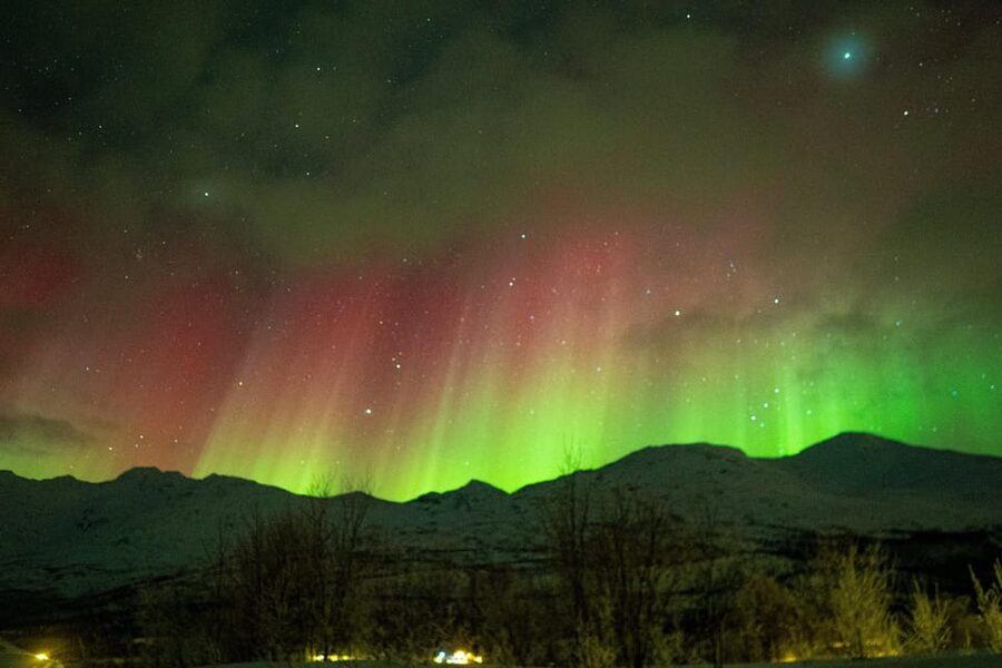 Tromsø: Small-Group Adventurous Northern Lights Hunt - Walking through snow to a frozen lake